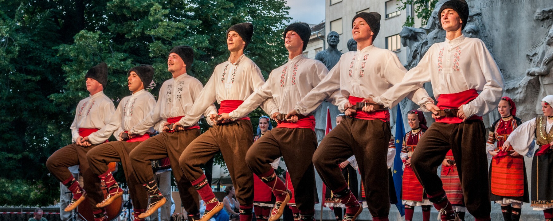 Budapest, XVIII. Danube carnival - The Southern Slavic Dance Ensemble (Tököl) and the Kóló Band. Attribution: Wilfredor, CC0, via Wikimedia Commons