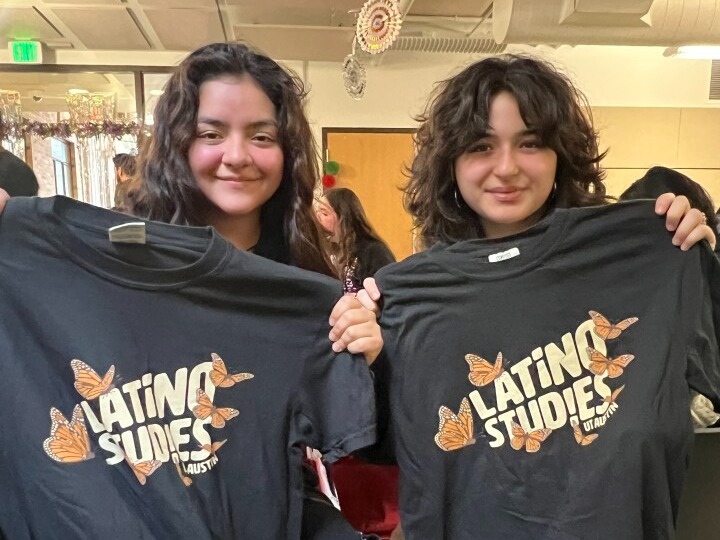two students holding Latino Studies bags
