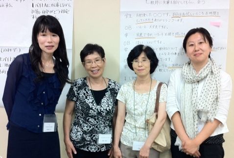 Dr. Yukie Aida (second from left) with conference attendees.