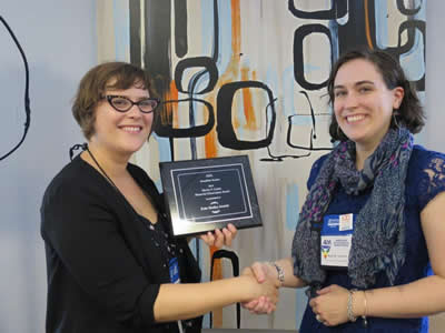 Cati Connell (left) presents Kate Averett with award