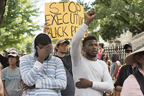 Demonstrators at a rally in front of the Governor's Residence, in St. Paul, Minn., July 7, 2016. (Angela Jimenez/The New York Times)