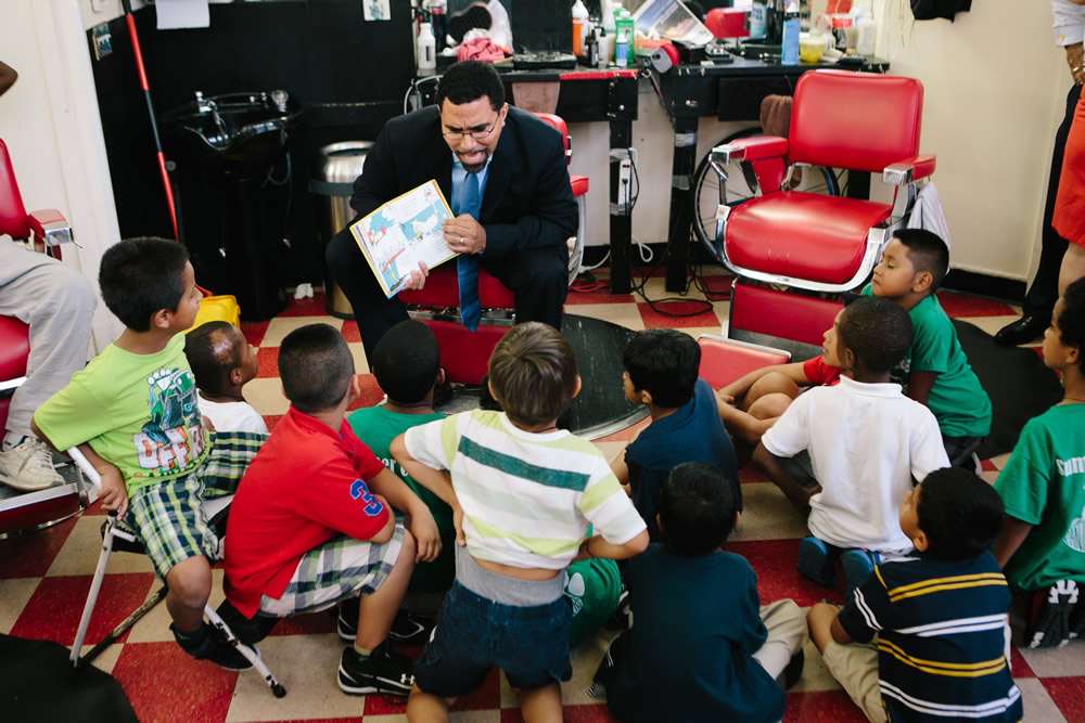 John B. King reading to students.