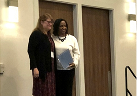 Dr. Berry accepting SHEAR award