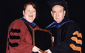 Dr. Zigler receiving the 2000 UT Graduate School Distinguished Alumnus Award from Vice-Provost and Dean of the Graduate School Dr. Teresa Sullivan