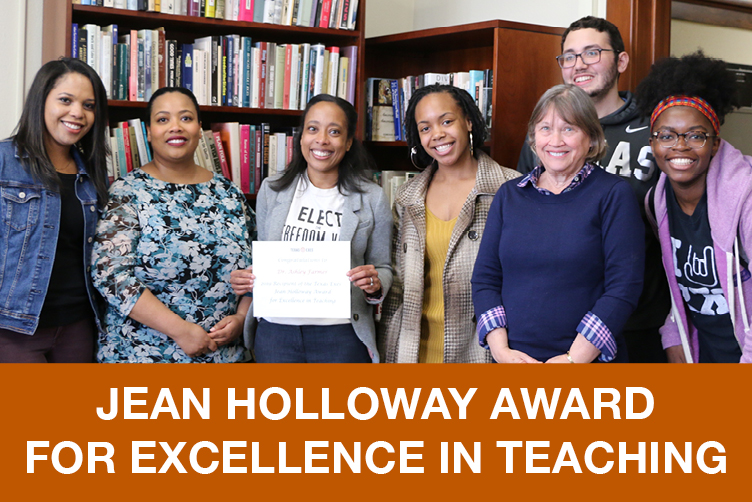 Dr. Farmer holding award, with Dr. Jones, and History graduate & undergraduate students