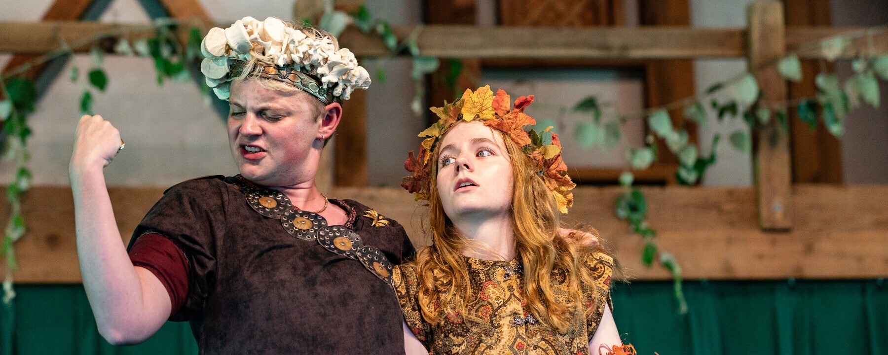 image of performer flexing an arm while other looks on in fear